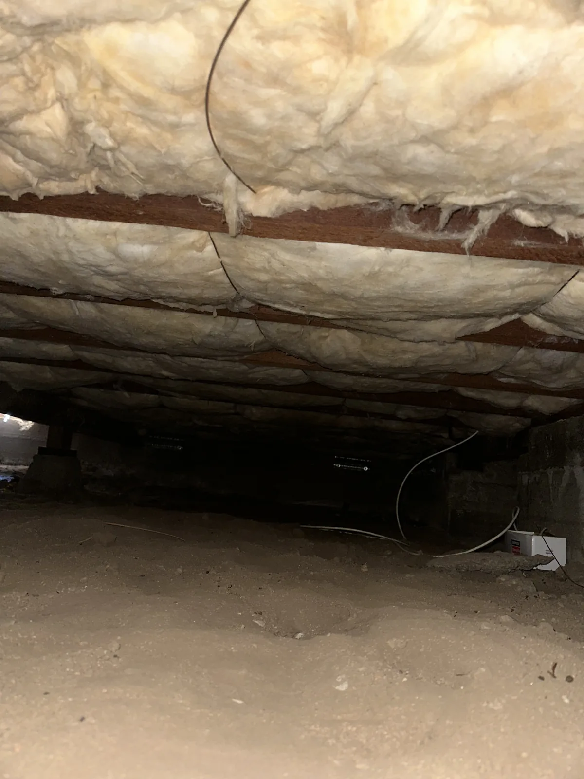 Crawl space insulation installed under a raised-foundation home in Granada Hills